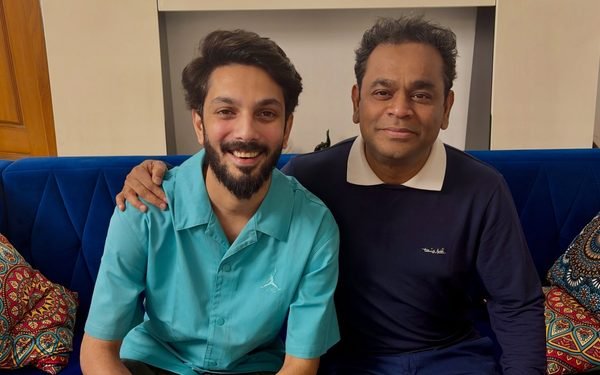 Anirudh Ravichander and AR Rahman posing together in a photograph