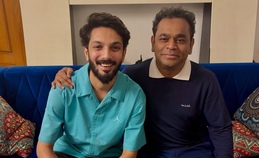 Anirudh Ravichander and AR Rahman posing together in a photograph
